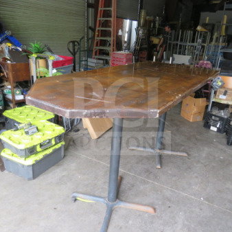 Wooden bar height table, dimensions 84x36x43 inches, with two metal pedestal bases. Visible wear on tabletop.