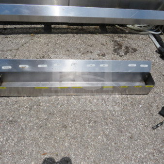 36-inch stainless steel speed rail, sturdy condition, ideal for bar organization, visible mounting holes on back panel.