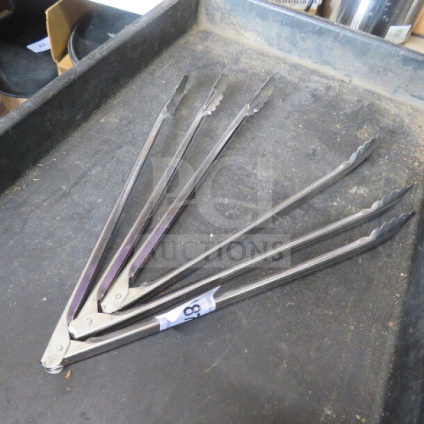 Stainless steel tongs set, 3XBID model, in good condition. Features sturdy design and serrated edges for better grip.