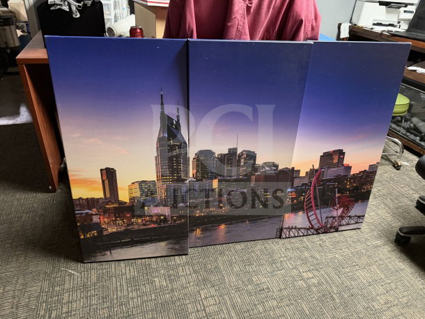 Three-panel canvas of Nashville skyline at sunset, each 18x36 inches. Vibrant colors, good condition.