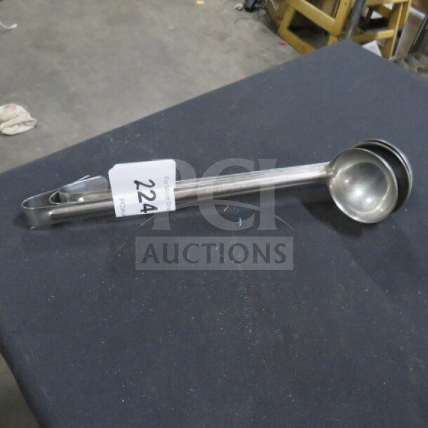 2oz stainless steel ladle, marked with "3XBID", in good condition, tag reads "224".