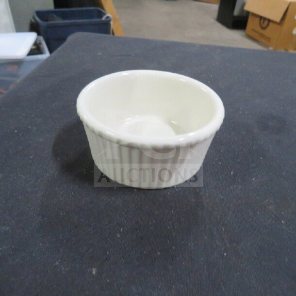 White 4oz ramekin with fluted exterior, in excellent condition. Ideal for serving sauces or desserts. Model 12XBID.