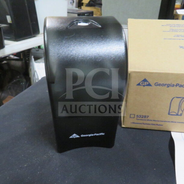 Georgia Pacific wall mount air freshener, model 53257, new condition, black finish, logo visible, with box in background.
