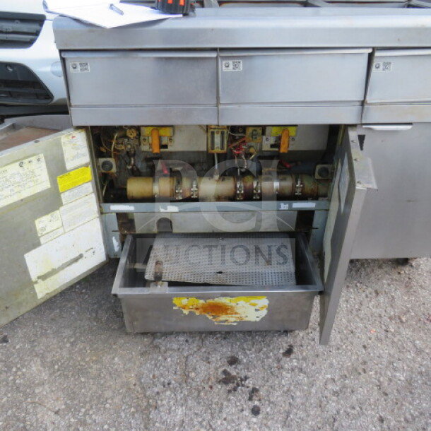 Frymaster MJ350 natural gas 50lb 3-unit floor fryer with millivolt controls, showing interior components, used condition.