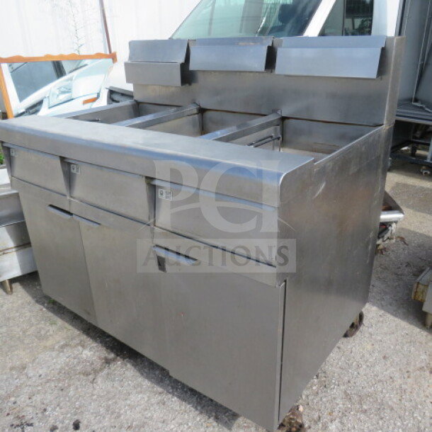 Frymaster MJ350 natural gas 50lb 3-unit floor fryer with millivolt controls. Stainless steel, used condition.
