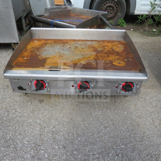 Star One Star Electric 36" Griddle, thermostatic control, 208-240V, dimensions 36x27x15, used condition, rust visible.