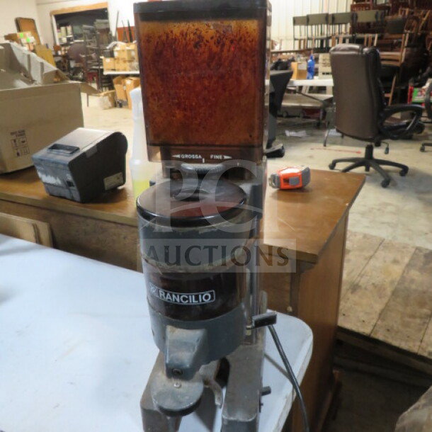 Rancilio MD-50 grinder, used condition, visible wear. Adjustable grinder setting. Model label intact.