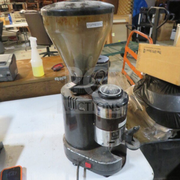 Rossi Grinder RR45AA, black with stainless steel components, visible wear, "ESPRESSO" label on hopper, electric plug attached.