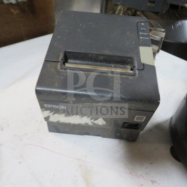 Epson M244A thermal printer, used, dusty exterior, power and feed buttons visible. Model and brand labels intact.