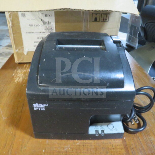 Star SP700 Thermal Printer, black, power cord attached, model labeling visible. Good condition, slight surface wear.