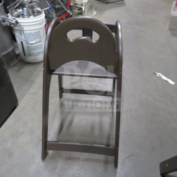 Koala Kare poly high chair with safety straps, brown finish, sturdy frame, for infant safety, good condition.
