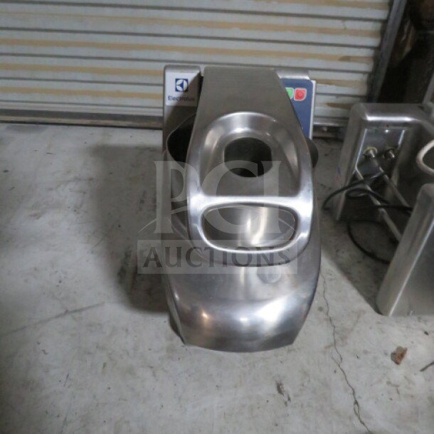 Electrolux vegetable slicer, model TRS-24NU, stainless steel, 120V, used condition, with visible brand logo and control panel.