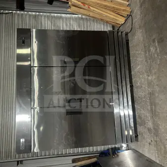 Coldline C-3FE 3-Door Freezer on casters, 115V, stainless steel, model label, 81x32x81.5 inches, excellent condition.