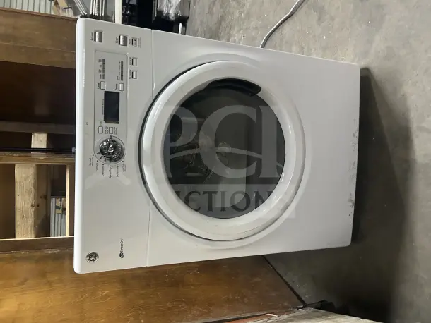 GE Front Load Dryer Model GFDN110ED2WW in white. Features various cycles. Working when removed. Visible wear on front.