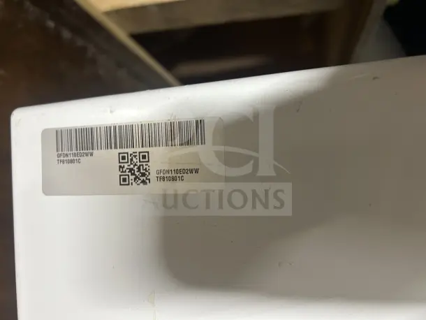 GE front load dryer, model GFDN110ED2WW, in working condition when removed. Visible label with model number.
