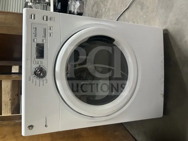GE front load dryer Model GFDN110ED2WW, white, SensorDry, with control panel. Working condition. Visible scuffs on bottom.