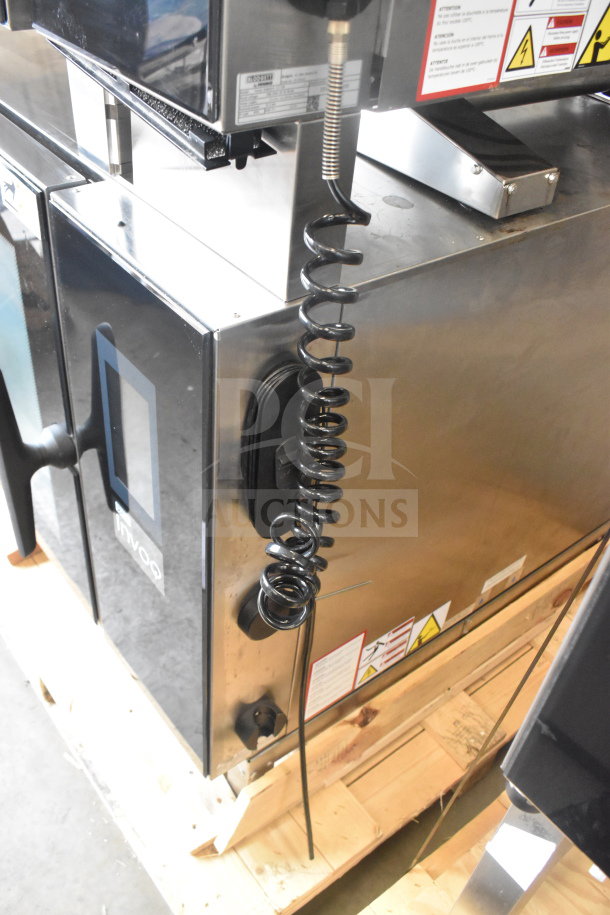 Brand new 2023 Blodgett Invoq Hybrid 6-2/1 GN commercial electric combi convection oven, 208-240V, 3 phase, scratch and dent condition, with labels and cables visible.