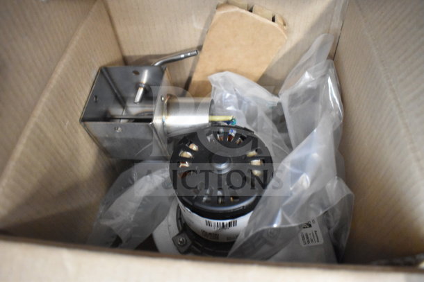 Image of boxed components for a 2024 Blodgett Invoq Hybrid 10-2/1GN combi convection oven, showing metal parts and packaging materials.