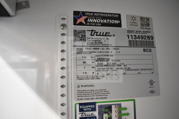 New True TSCI-600R-G-PH cooler label showing model details, 115V, refrigerant type, and serial number 11349289.