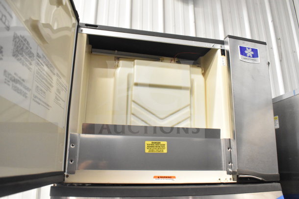 Manitowoc SD0452A Ice Head on SPA310 Dispenser, 115V, 1 Phase. Stainless steel, commercial use, clean interior, visible labels.