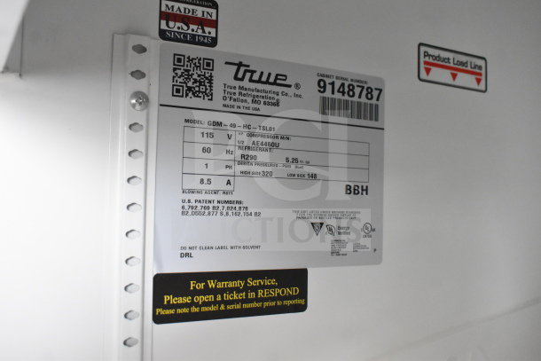 2017 True GDM-49-HC commercial 2-door cooler, 115V, 1 phase, tested and working. Features labels with model and service info.