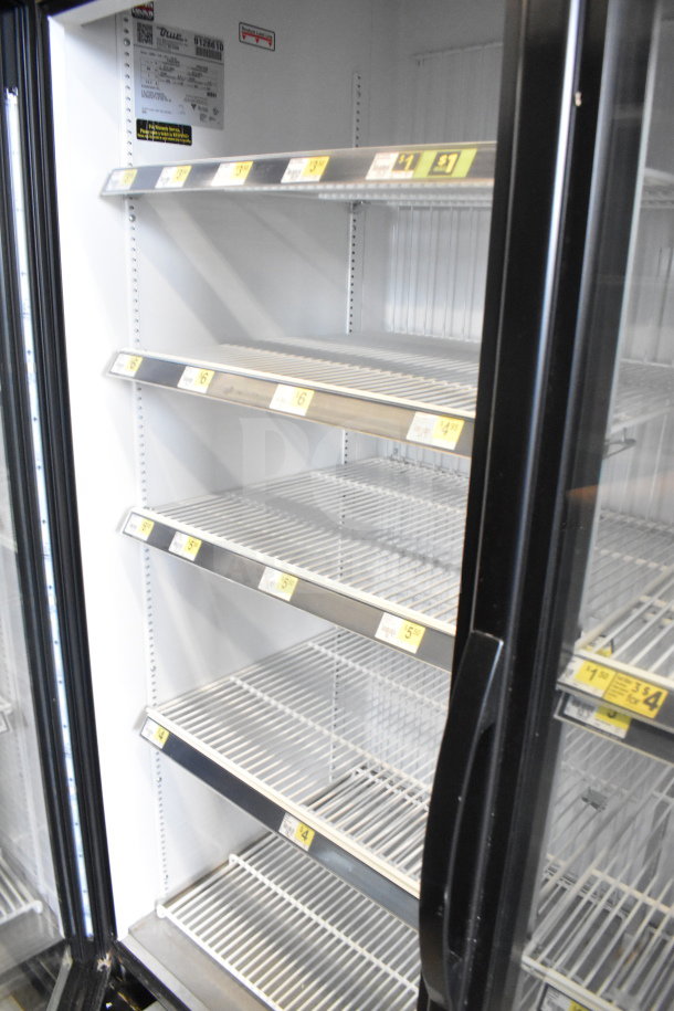 2017 True GDM-72F-HC 3 door freezer merchandiser, tested, working, 115/208-230V, 1 phase, interior shelves visible.