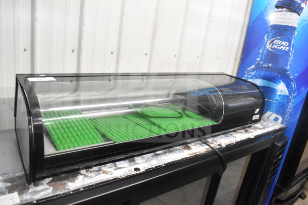 Emperor's Select CSD-53 refrigerated sushi case, model 478csd53hc, 115V, clear front, green interior mats, good condition.