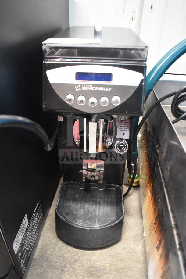 Nuova Simonelli Mythos One Clima Pro Espresso Grinder, 115V, commercial-grade, with visible control panel in used condition.