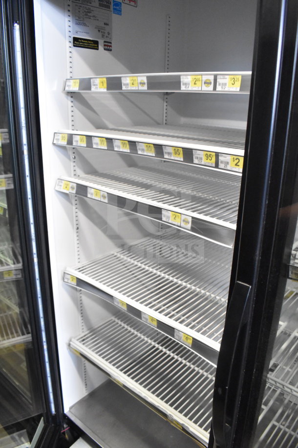 2017 True GDM-72-HC 3 door cooler merchandiser, 115V, tested working, clean shelves, labels visible, excellent condition.