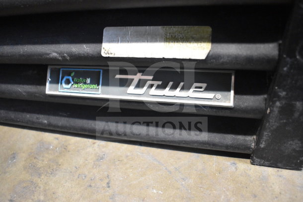 2017 True GDM-72-HC cooler merchandiser, 3 doors, 115 volts, tested and working. True logo and natural refrigerant label visible.