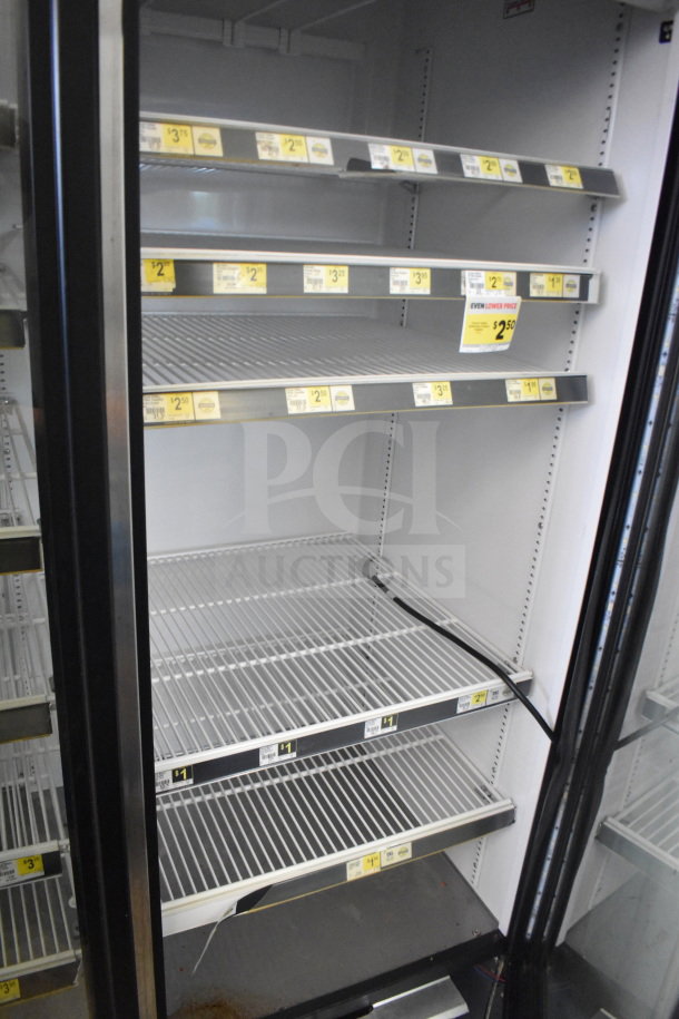 2017 True GDM-72-HC 3 Door Cooler, 115V, tested and working, clean interior with shelves and product tags visible.