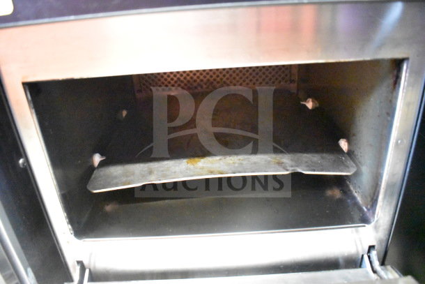 2025 Merrychef eikon e2s high-speed countertop microwave convection oven, 208/240V. Interior view, used condition.