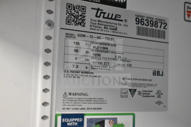 Label on 2019 True GDM-72-HC cooler, showing model, serial number, voltage, refrigerant type, and safety warnings.