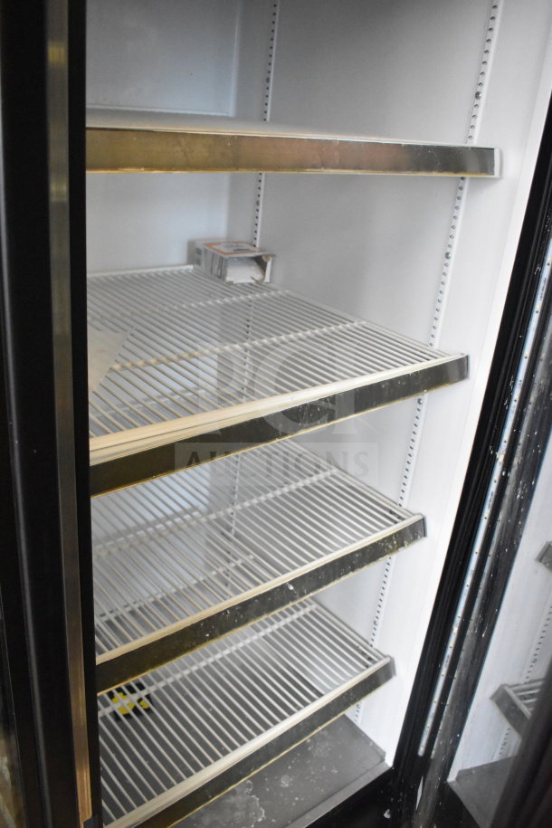 2019 True GDM-72-HC commercial 3-door reach-in cooler merchandiser. 115 volts, 1 phase, tested and working. Clean shelves.