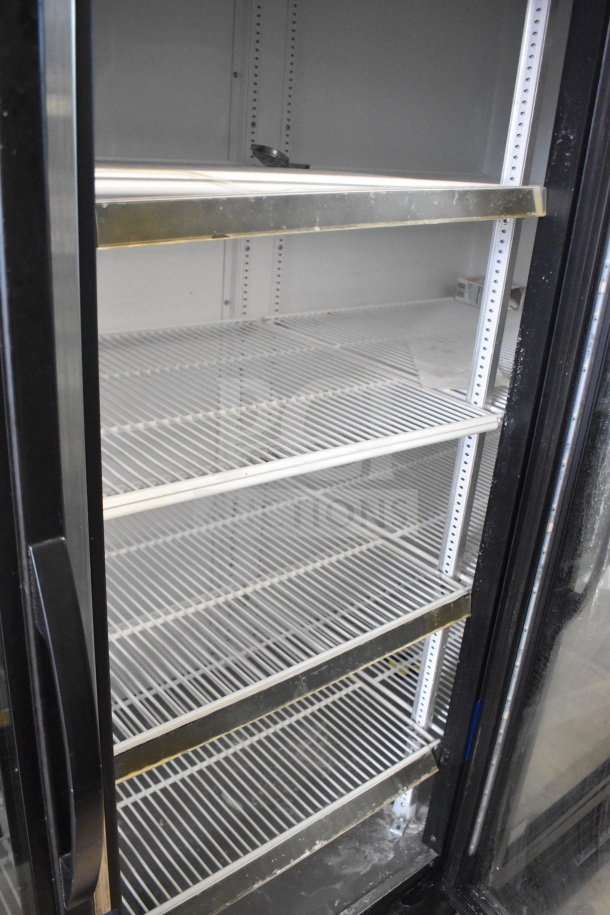 2019 True GDM-72-HC commercial cooler, 3 glass doors, tested working, metal shelving, 115V, 1 phase.