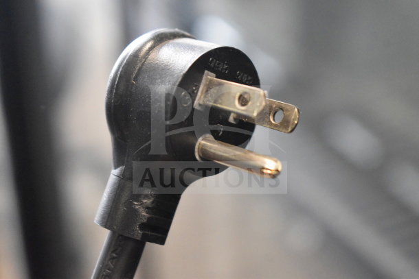 Close-up of the power plug for a 2019 True GDM-72-HC commercial cooler, showing standard three-prong configuration.