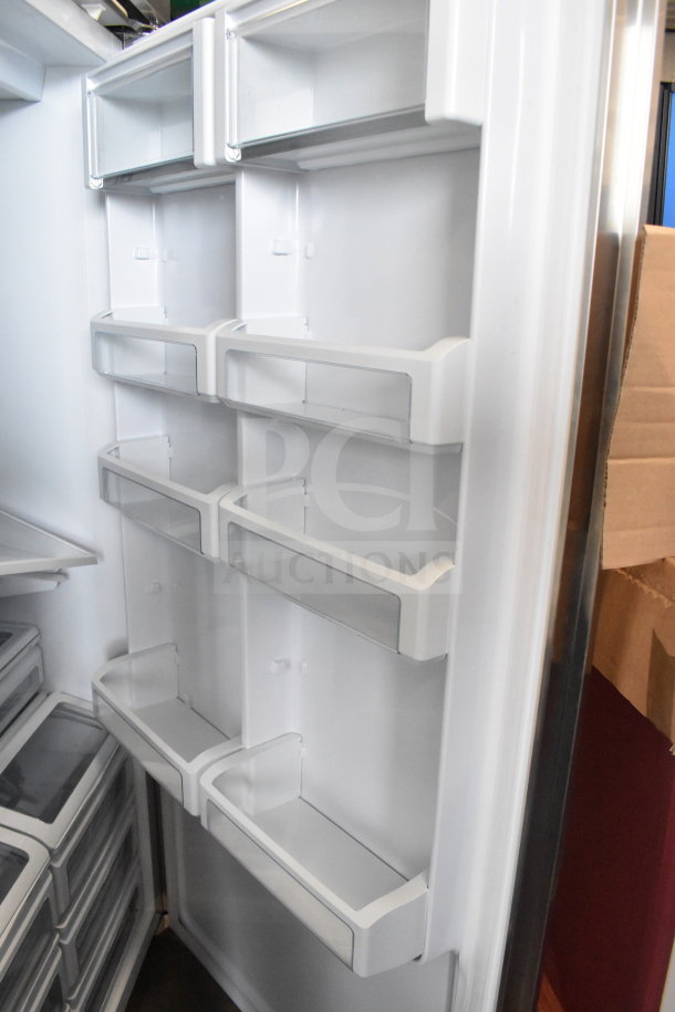 Stainless steel single door reach-in cooler interior, white shelves, and door bins. Appears in excellent condition.