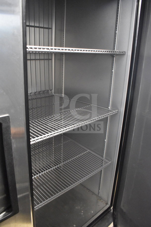 2019 True T-49F-HC commercial 2-door cooler, stainless steel interior, on casters, 115V, tested and working.