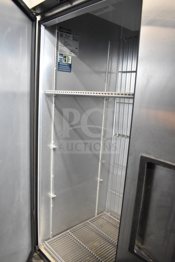 2019 True T-49F-HC cooler, 2-door reach-in, commercial casters, 115 volts, 1 phase, tested and working, visible interior shelving.