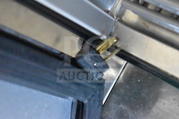 Close-up of lock in the door seam of a 2019 True T-49F-HC commercial cooler, emphasizing security feature.