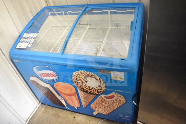 AHT RIO S 100 commercial chest freezer, 115 volts, 1 phase, features dual glass lids, vibrant ice cream graphics, tested working.