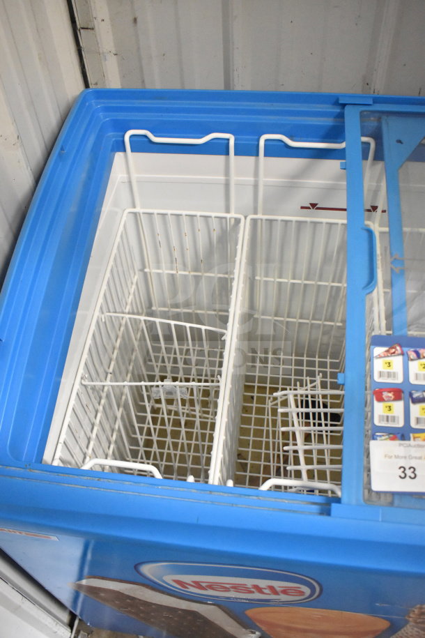 AHT RIO S 100 Commercial Chest Freezer Merchandiser, 115V, 1 Phase, tested and working, blue lid, wire baskets inside.