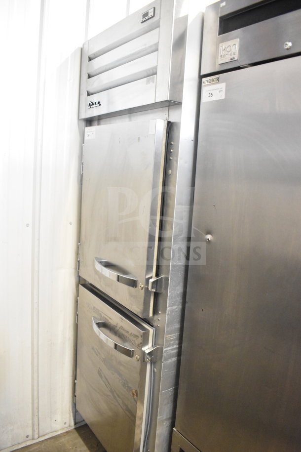 2021 True STG1F-2HSLH-HC commercial cooler, two half-size doors, stainless steel, on casters, 115V, 1 phase.