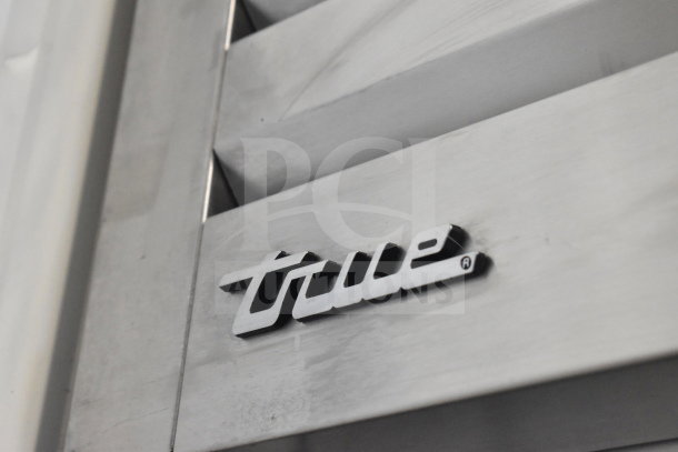 True STG1F-2HSLH-HC commercial cooler close-up, showing brand logo. 2021 model on casters, 115V, 1 phase.