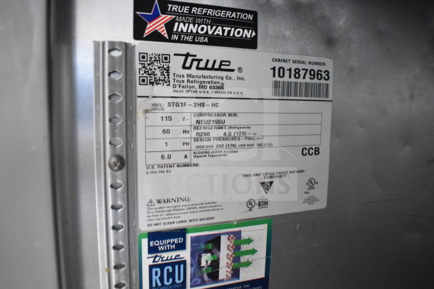 2021 True STG1F-2HSLH-HC 2 Half Door Cooler, 115V, 1 Phase. Features innovation label, model info, and warnings.