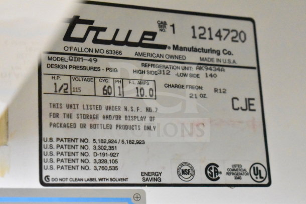 True GDM-49 Commercial Cooler label showing model, 115V, 1 phase, NSF certification, and energy-saving badge.