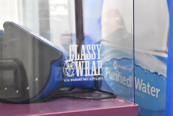 Countertop dry merchandising display case, featuring Classy Wrap logo with U.S. Patent No. 4,974,393. Clean and well-maintained condition.