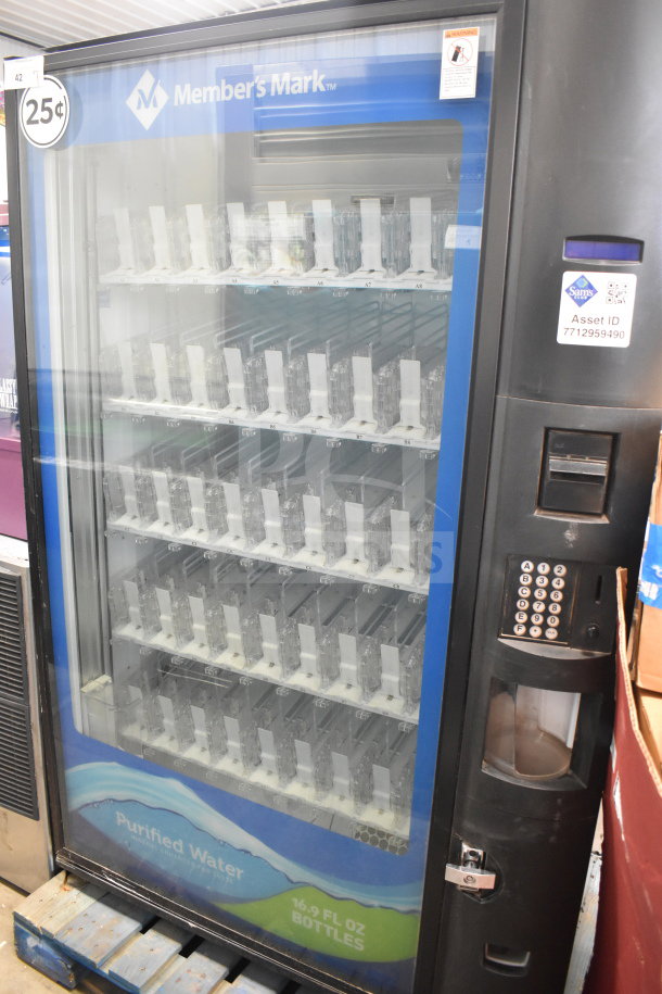 Crane 5800-4 vending machine with bill acceptor, displays 16.9 oz bottle slots, 25¢ price label, and asset ID tag.