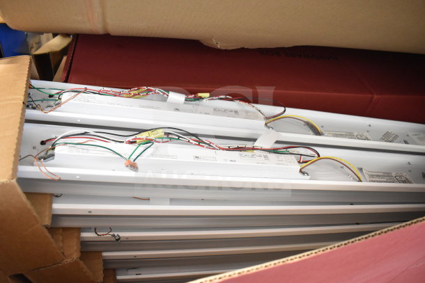 67 Loeb Electric lighting fixtures, new in box, visible wiring and labels, 67 times your bid, ideal for bulk purchase.