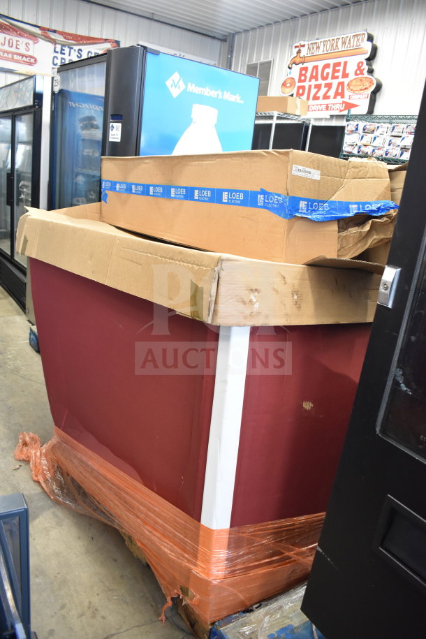 Stack of 67 Loeb Electric lighting fixtures in boxes, some wear on packaging, labeled with Loeb Electric tape.